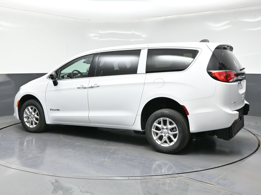White Chrysler Voyager with Rear Entry Manual Fold Out ramp