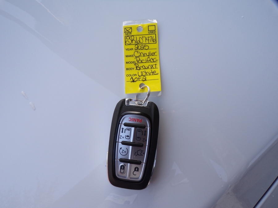 White Chrysler Pacifica with Side Entry Automatic Fold Out ramp