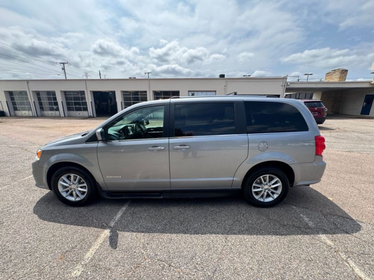 Silver Dodge Grand Caravan with Side Entry Automatic Fold Out ramp