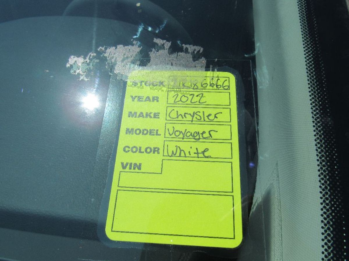 White Chrysler Voyager with Side Entry Automatic Fold Out ramp