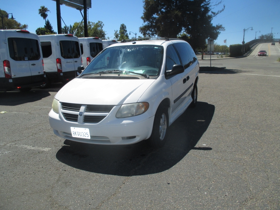 White Dodge Grand Caravan with Side Entry Automatic Fold Out ramp