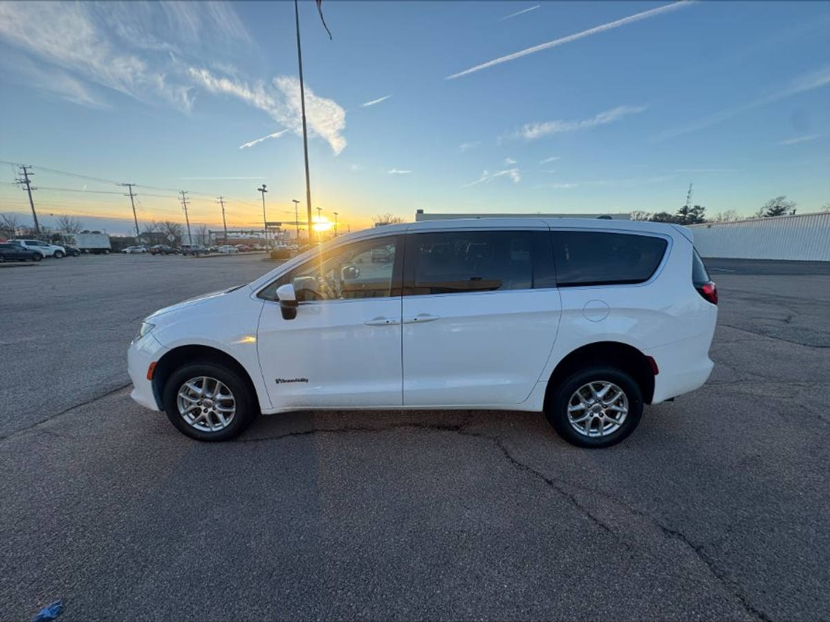 White Chrysler Voyager with Rear Entry Manual Fold Out ramp