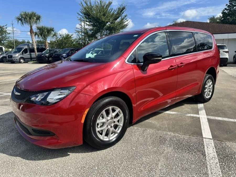 Red Chrysler Voyager with Rear Entry Manual Fold Out ramp