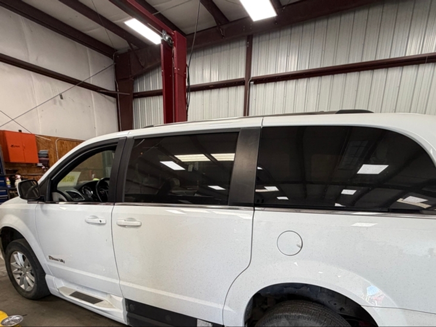White Dodge Grand Caravan with Side Entry Automatic In Floor ramp