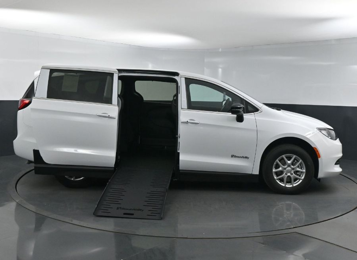 White Chrysler Voyager with Side Entry Manual Fold Out ramp
