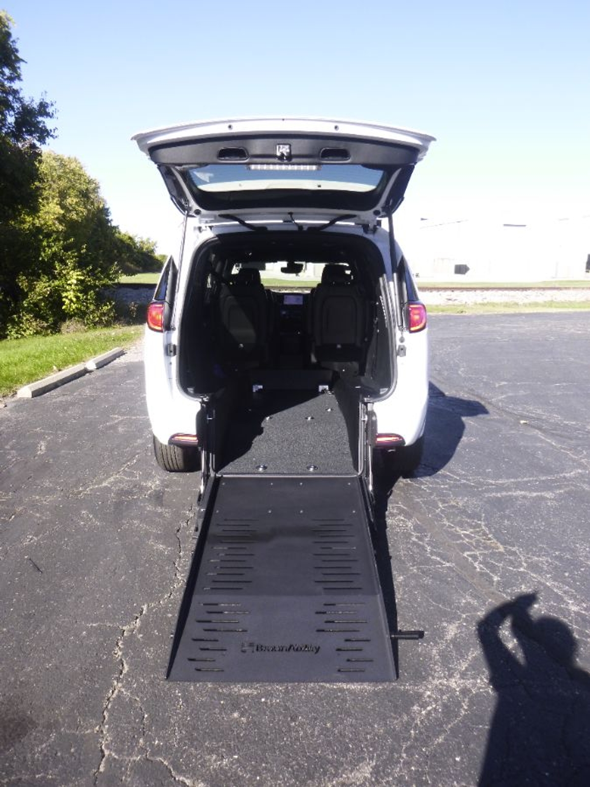 White Chrysler Voyager with Rear Entry Manual Fold Out ramp