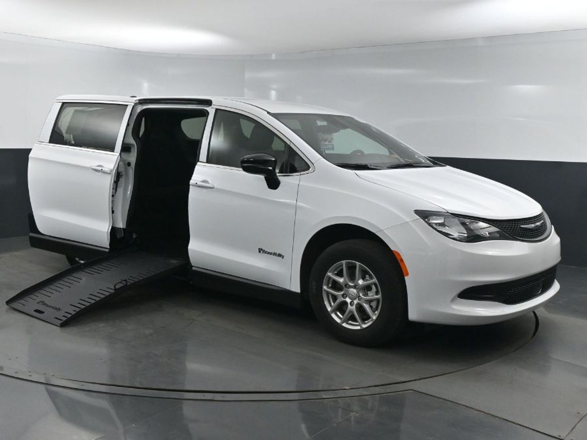White Chrysler Voyager with Side Entry Manual Fold Out ramp