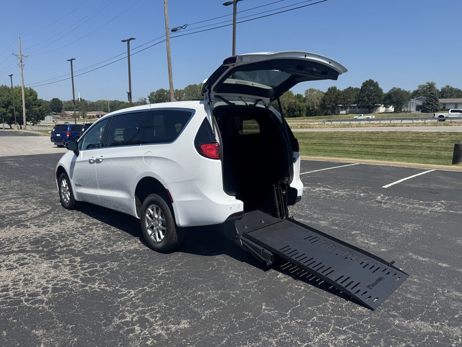White Chrysler Voyager with Rear Entry Manual Fold Out ramp
