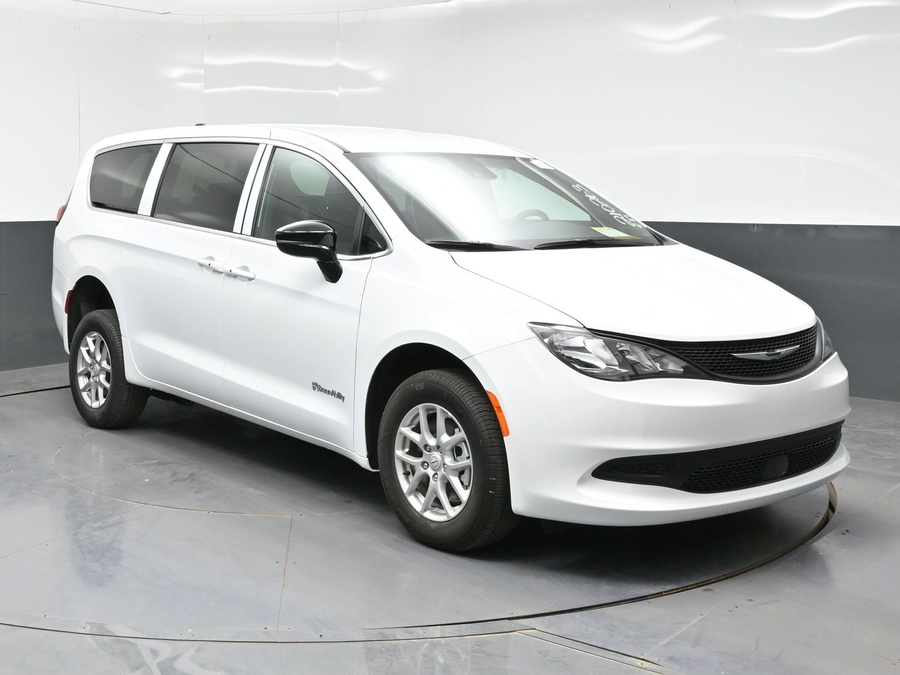 White Chrysler Voyager with Rear Entry Manual Fold Out ramp