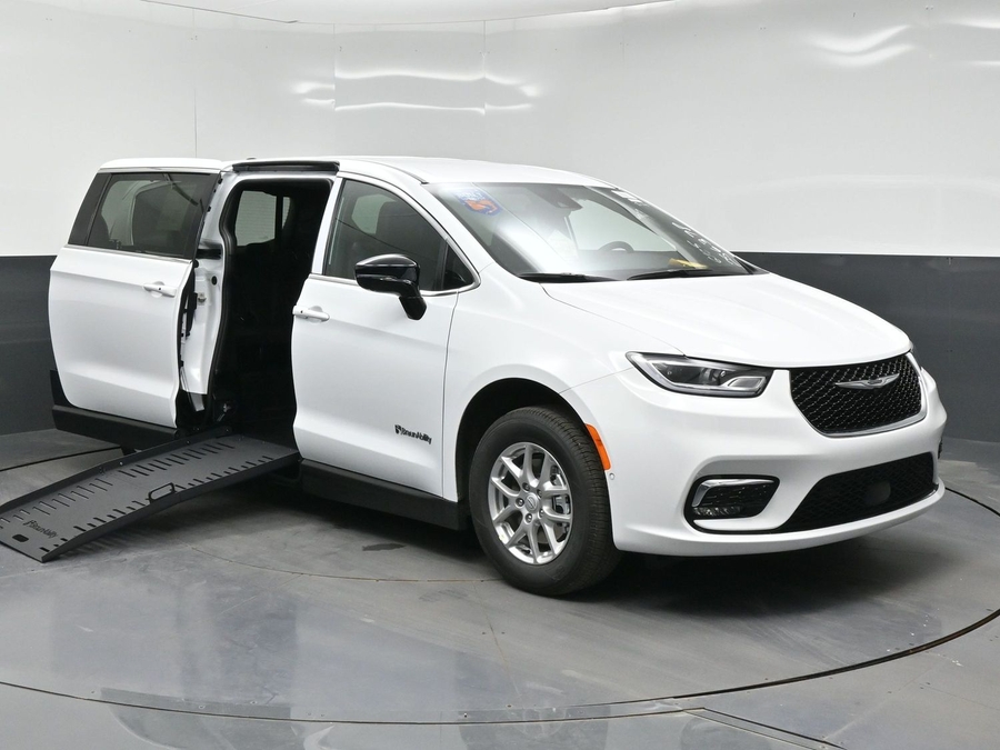 White Chrysler Pacifica with Side Entry Manual Fold Out ramp