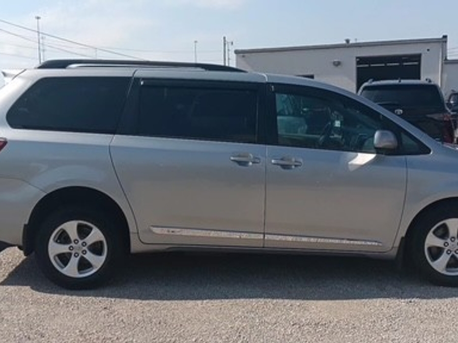 Silver Toyota Sienna with Rear Entry Manual Fold Out ramp