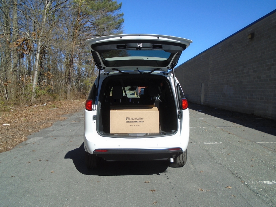 White Chrysler Voyager with Side Entry Manual Fold Out ramp