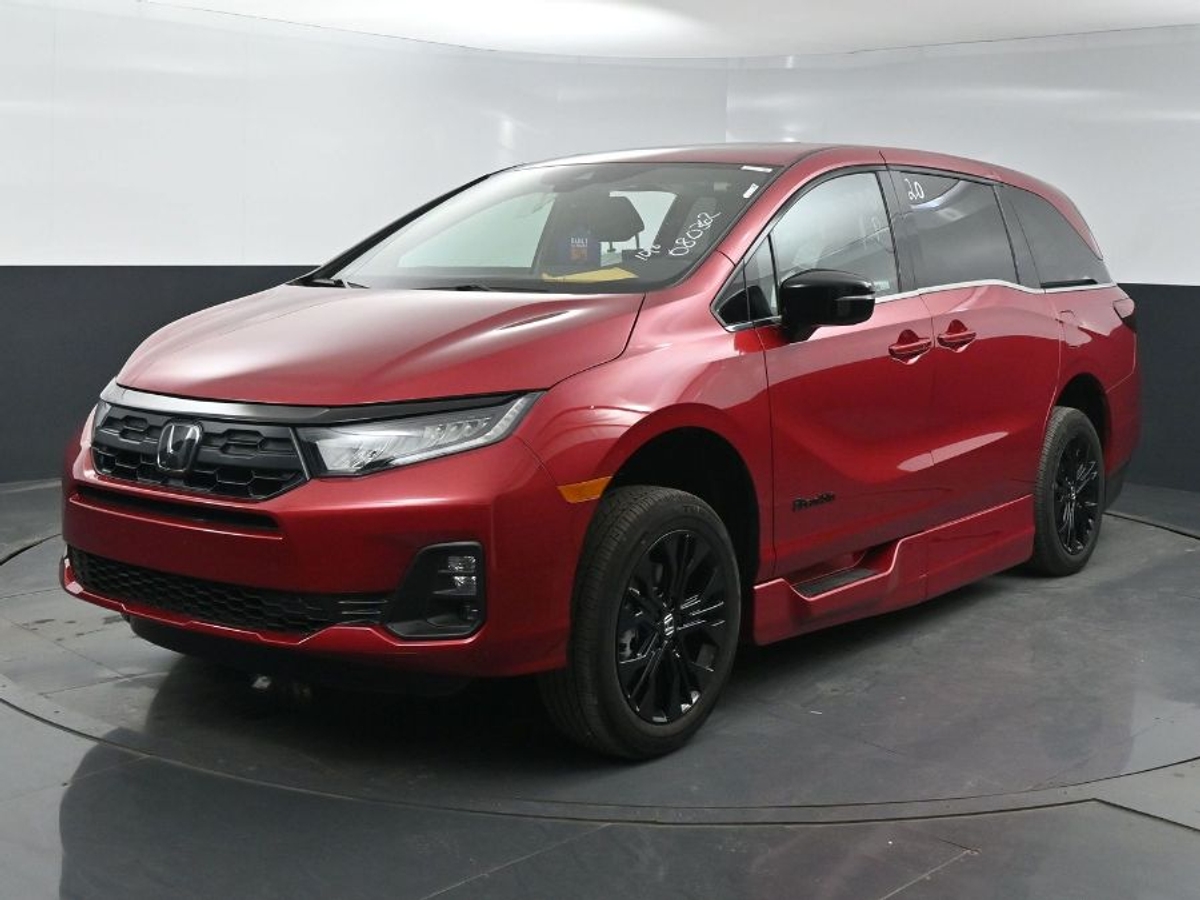 Red Honda Odyssey image number 3