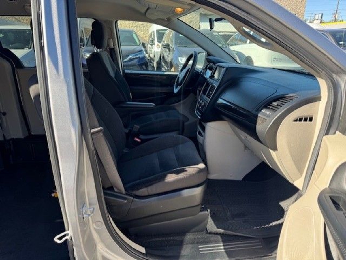 Silver Dodge Grand Caravan with Side Entry Manual Fold Out ramp