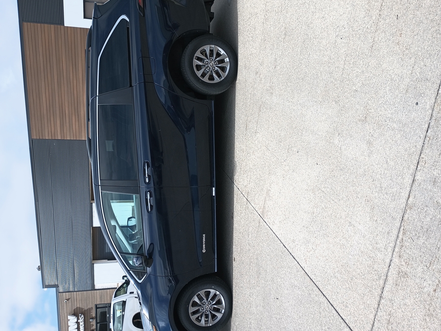 Blue Toyota Sienna with Rear Entry Manual Fold Out ramp