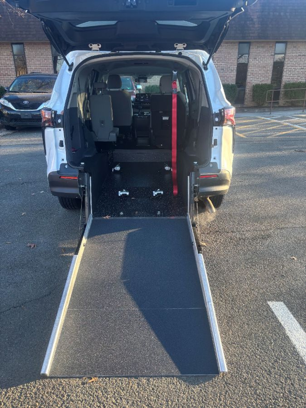 White Toyota Sienna with Rear Entry Manual Fold Out ramp