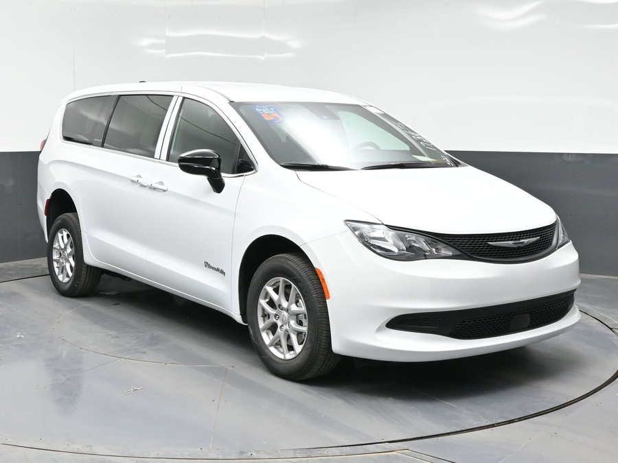 White Chrysler Voyager with Rear Entry Manual Fold Out ramp