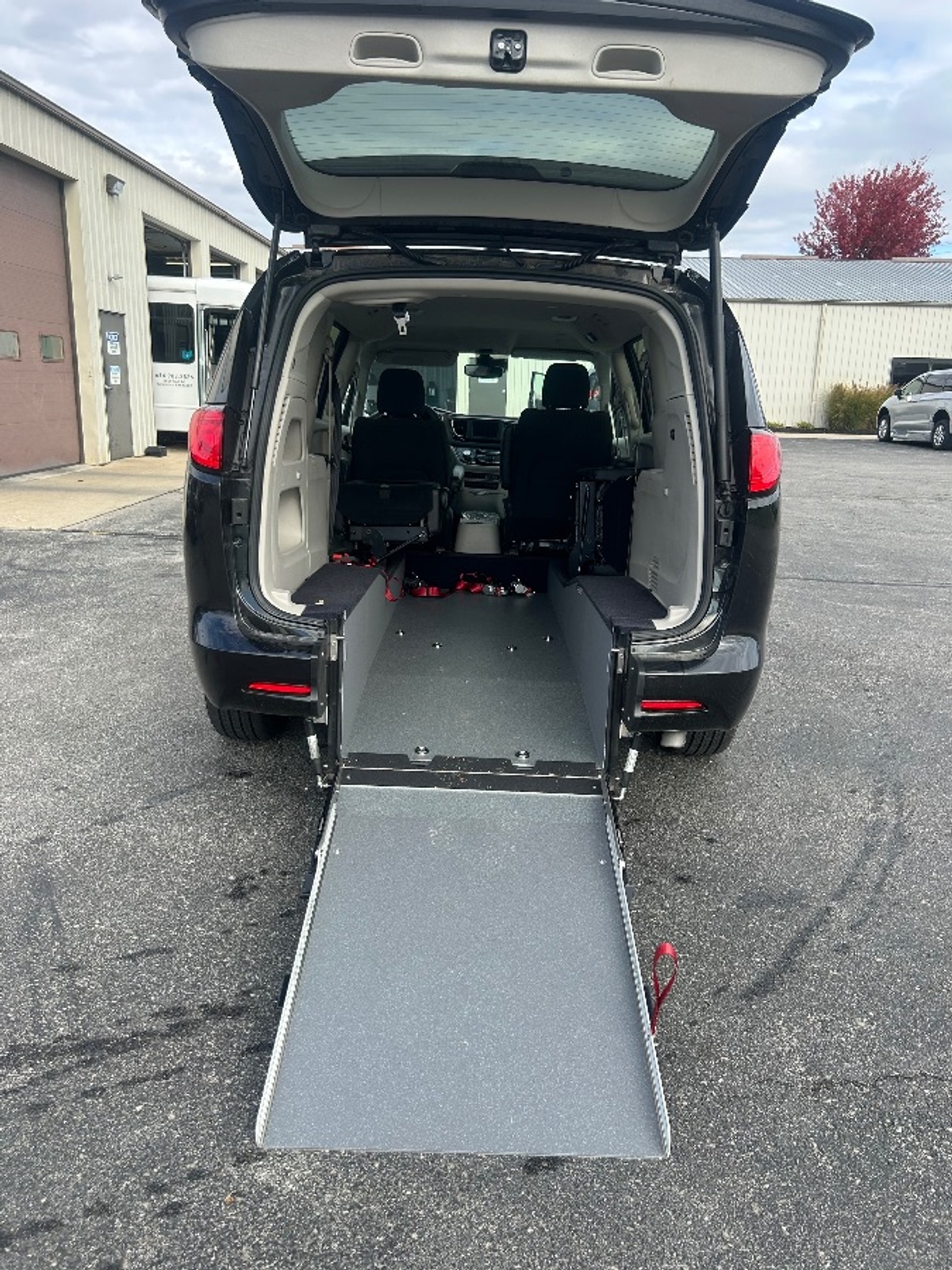Black Chrysler Voyager with Rear Entry Manual Fold Out ramp