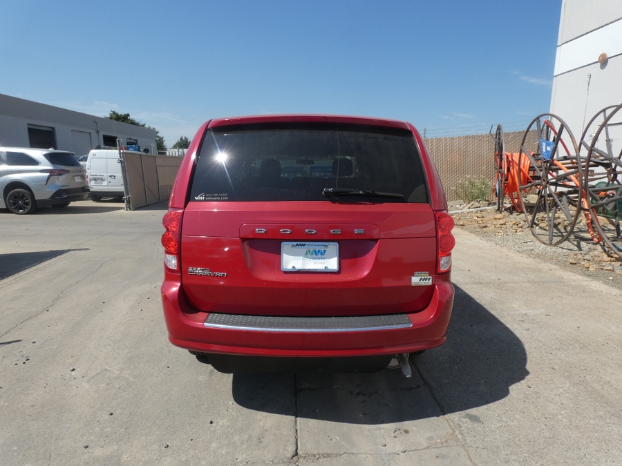 Red Dodge Grand Caravan with Side Entry Manual In Floor ramp