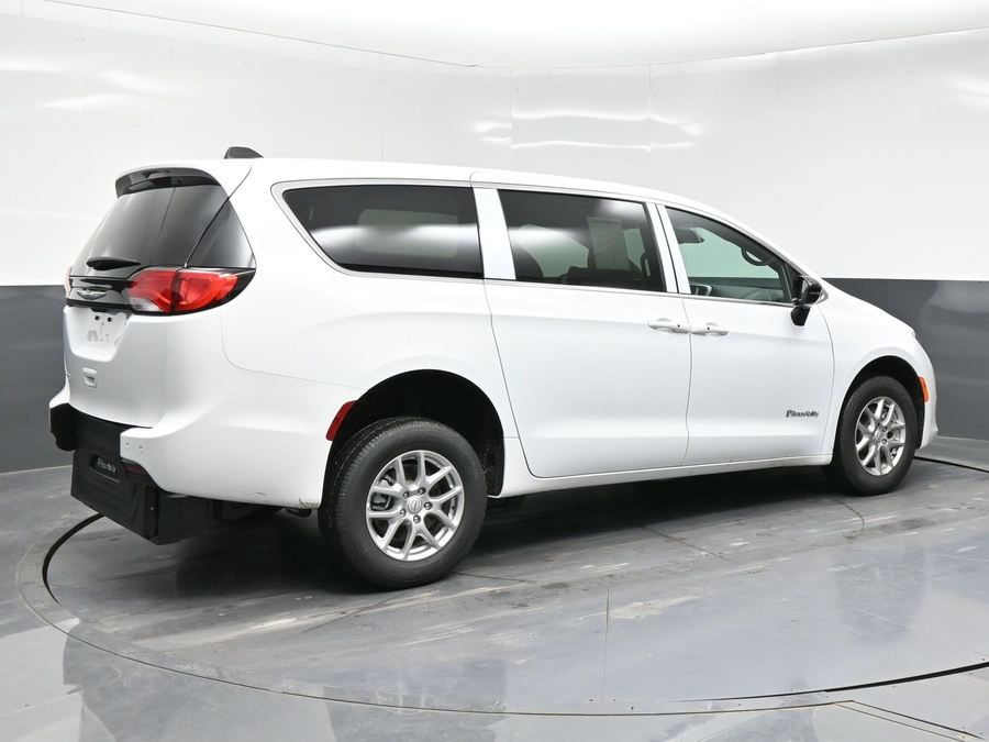 White Chrysler Voyager with Rear Entry Manual Fold Out ramp