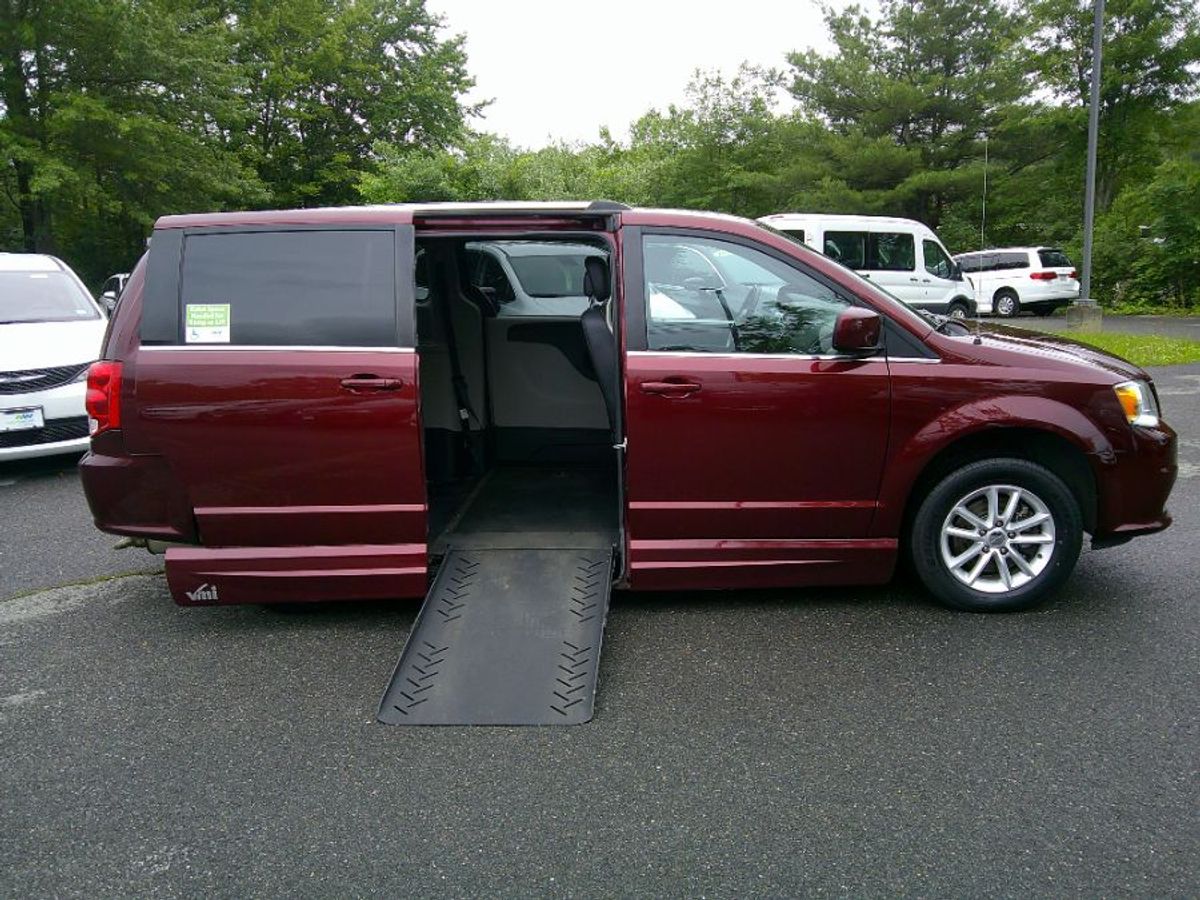 Red Dodge Grand Caravan with Side Entry Automatic Fold Out ramp