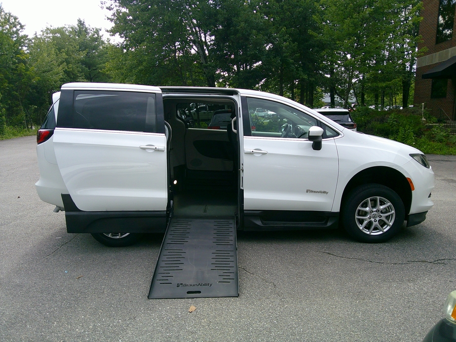 White Chrysler Voyager with Side Entry Manual Fold Out ramp