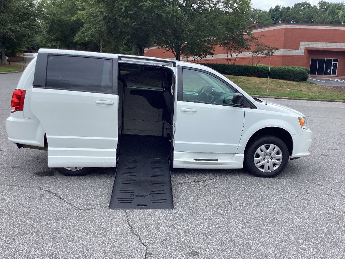 White Dodge Grand Caravan with Side Entry Manual Fold Out ramp