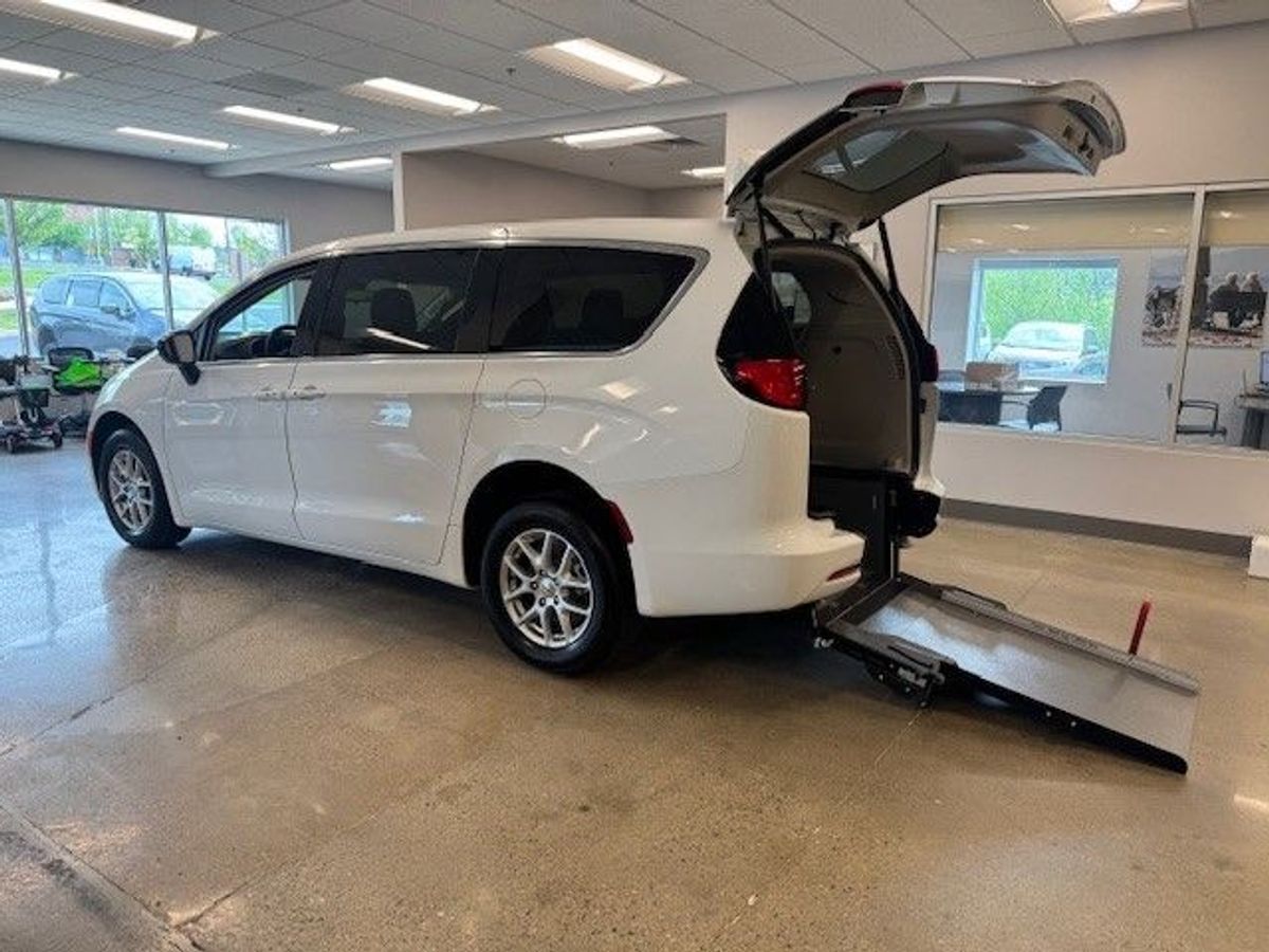 White Chrysler Voyager with Rear Entry Manual Fold Out ramp