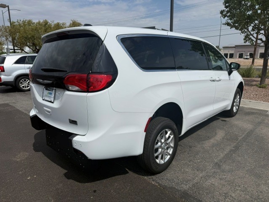 White Chrysler Voyager with Rear Entry Manual Fold Out ramp