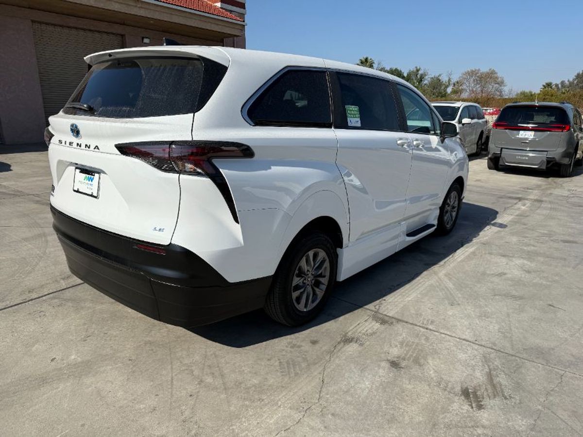 White Toyota Sienna with Side Entry Manual Fold Out ramp