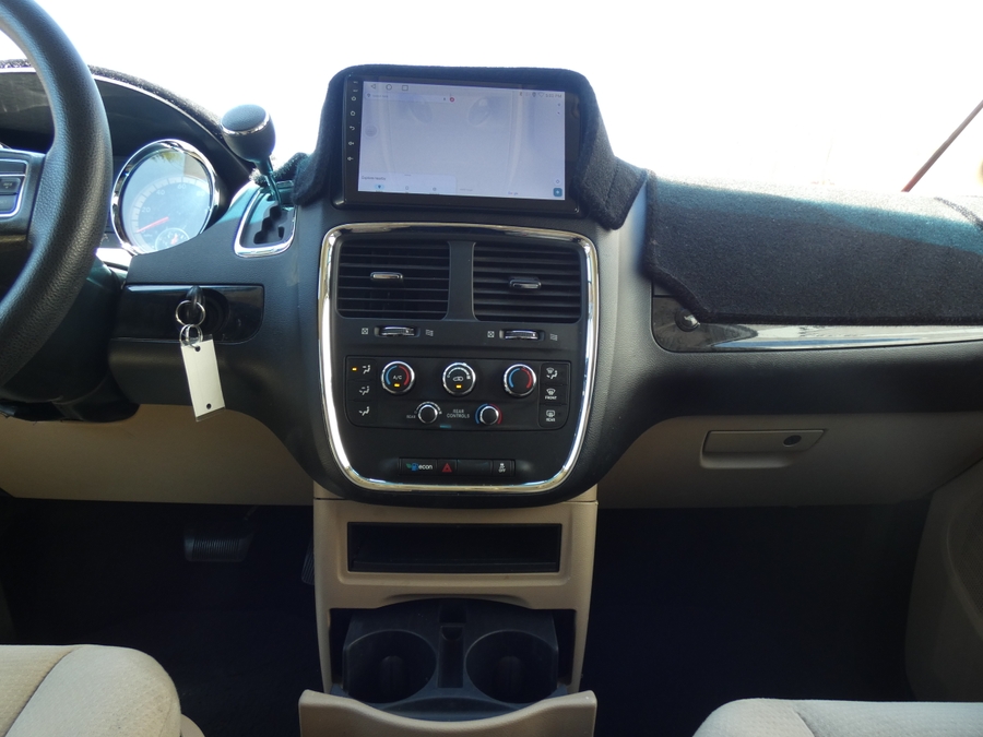 White Dodge Grand Caravan with Side Entry Automatic Fold Out ramp