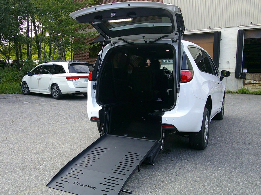 White Chrysler Voyager with Rear Entry Manual Fold Out ramp
