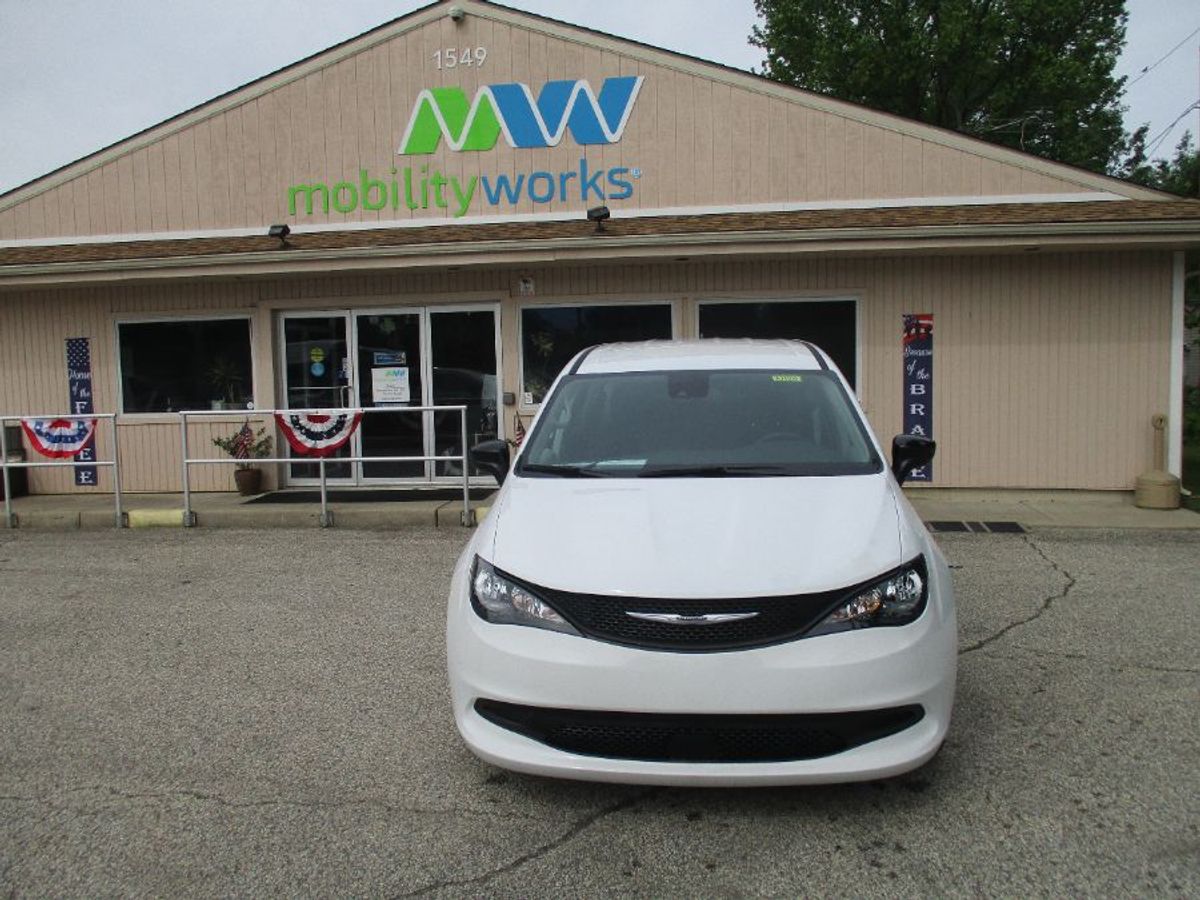 White Chrysler Voyager with Side Entry Automatic Fold Out ramp