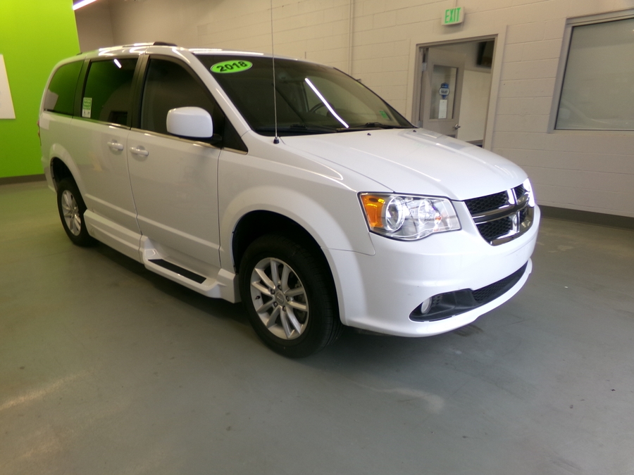 White Dodge Grand Caravan with Side Entry Manual In Floor ramp