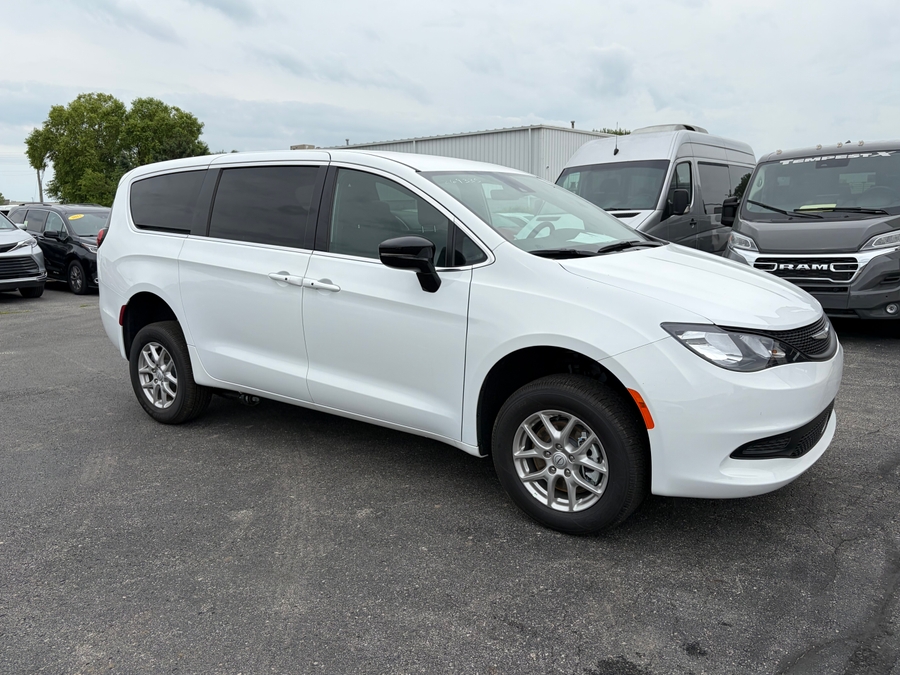White Chrysler Voyager with Rear Entry Manual Fold Out ramp