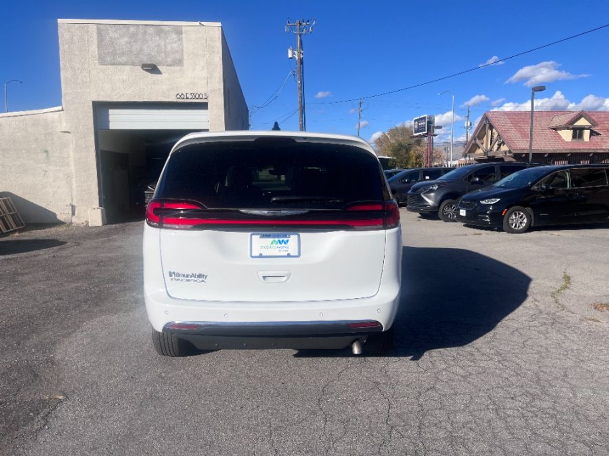 White Chrysler Pacifica with Side Entry Automatic Fold Out ramp