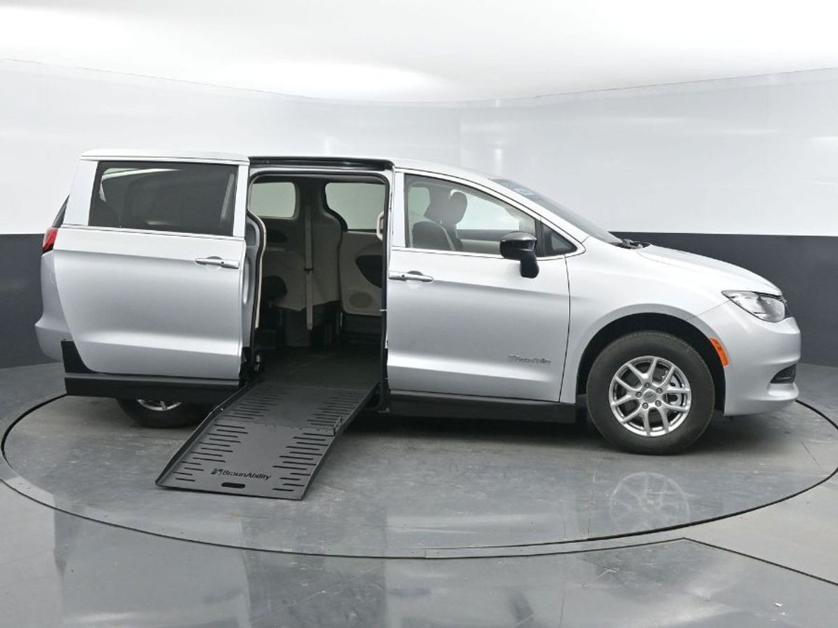 Silver Chrysler Voyager with Side Entry Manual Fold Out ramp
