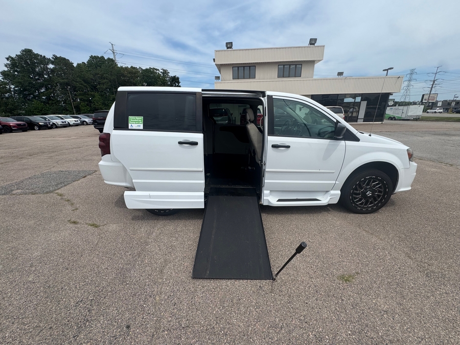 White Dodge Grand Caravan with Side Entry Manual In Floor ramp