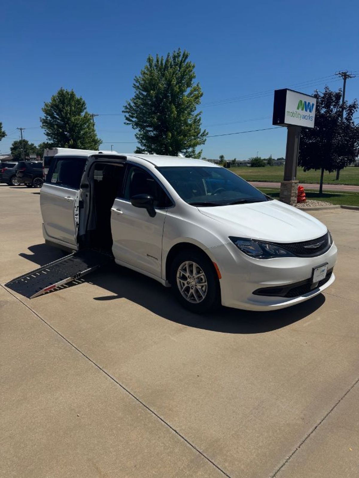 White Chrysler Voyager with Side Entry Automatic Fold Out ramp
