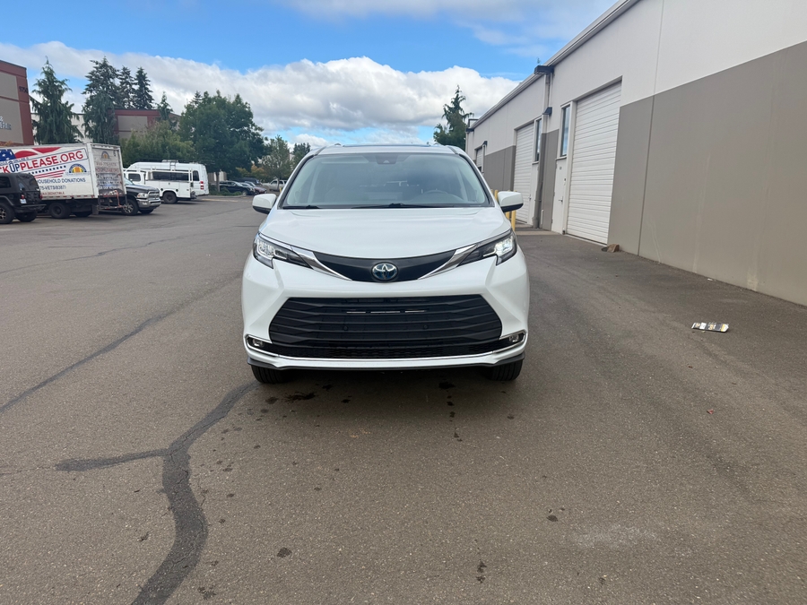 White Toyota Sienna with Side Entry Automatic Fold Out ramp