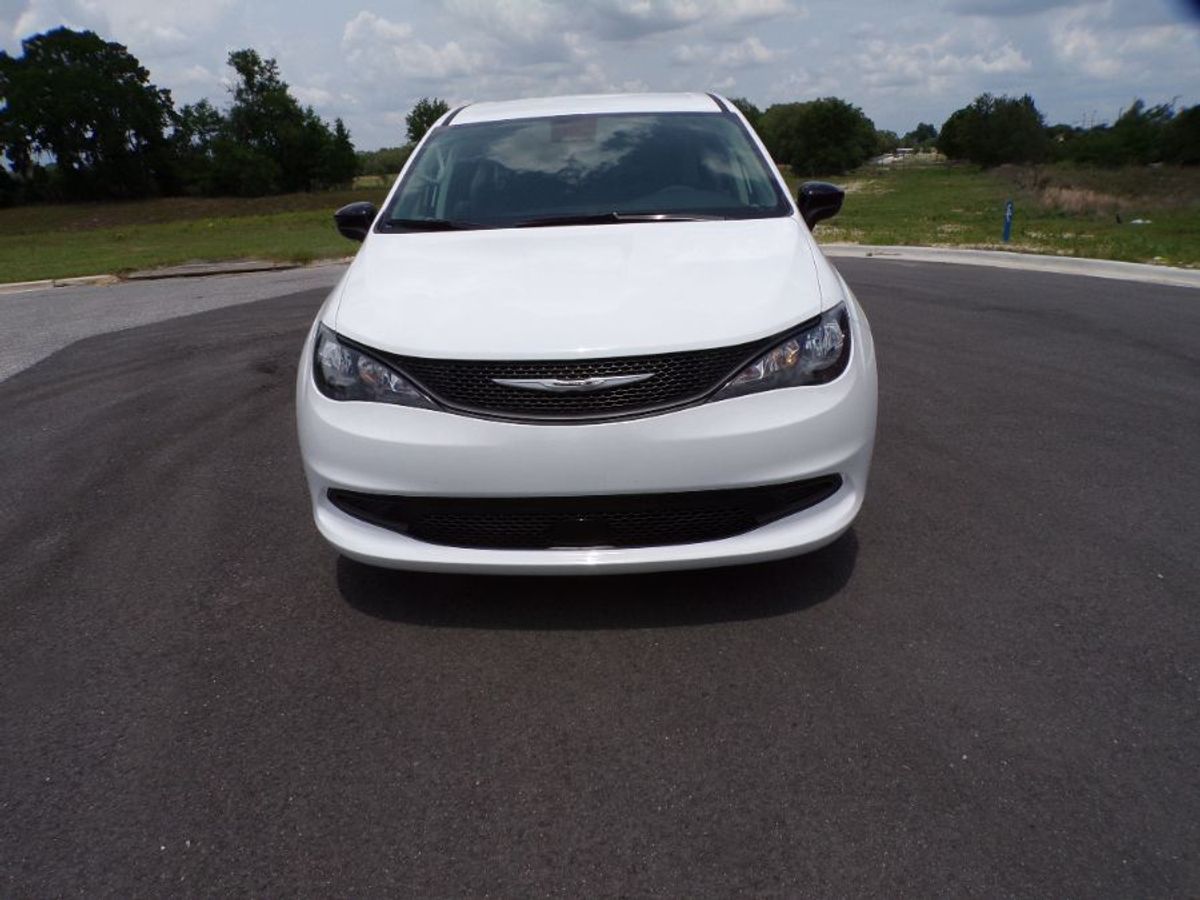White Chrysler Voyager with Side Entry Automatic Fold Out ramp