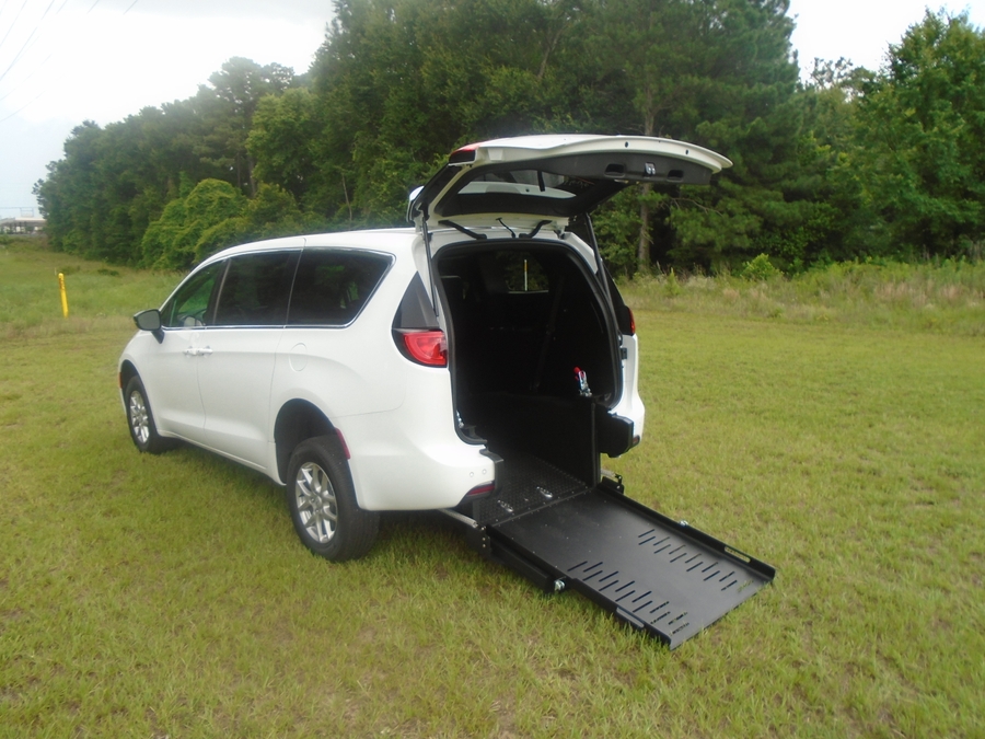 White Chrysler Voyager with Rear Entry Manual Fold Out ramp