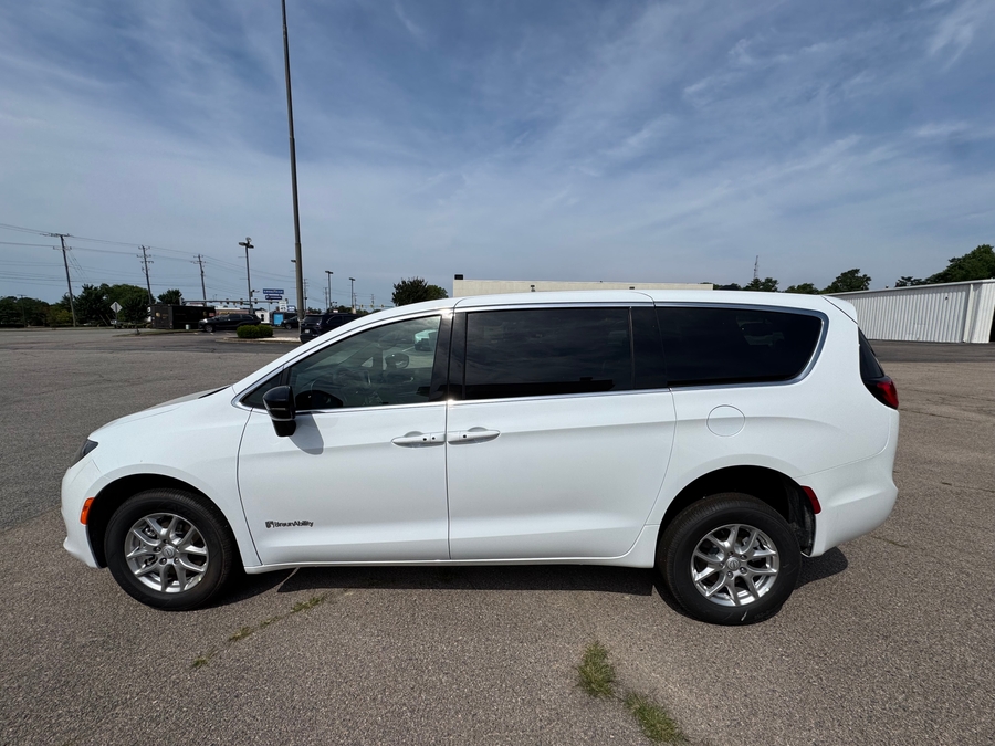 White Chrysler Voyager with Rear Entry Manual Fold Out ramp