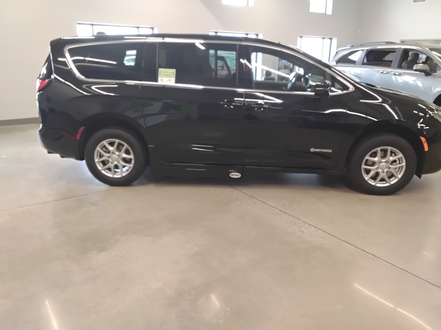White Chrysler Pacifica with Side Entry Automatic Fold Out ramp