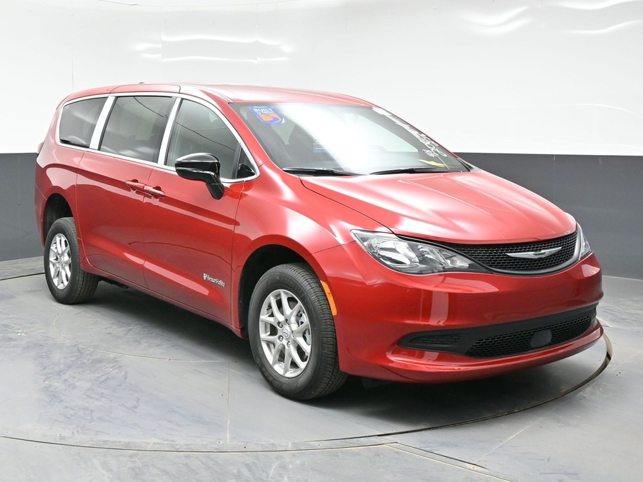 Red Chrysler Voyager with Rear Entry Manual Fold Out ramp