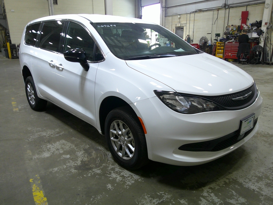 White Chrysler Voyager with Rear Entry Manual Fold Out ramp