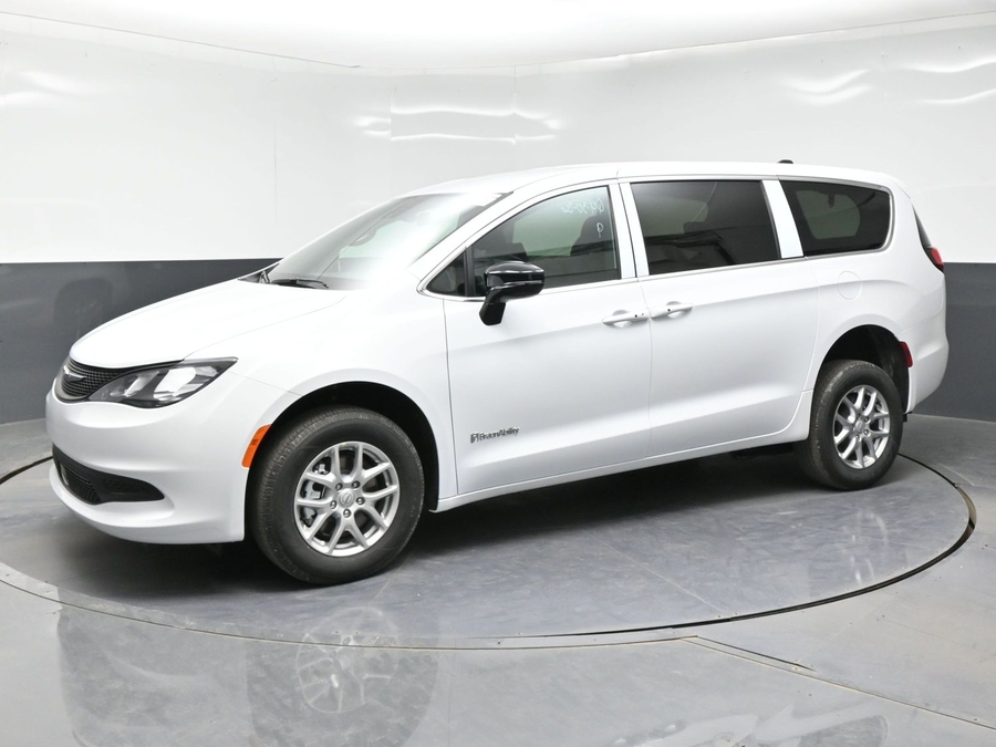 White Chrysler Voyager with Rear Entry Manual Fold Out ramp
