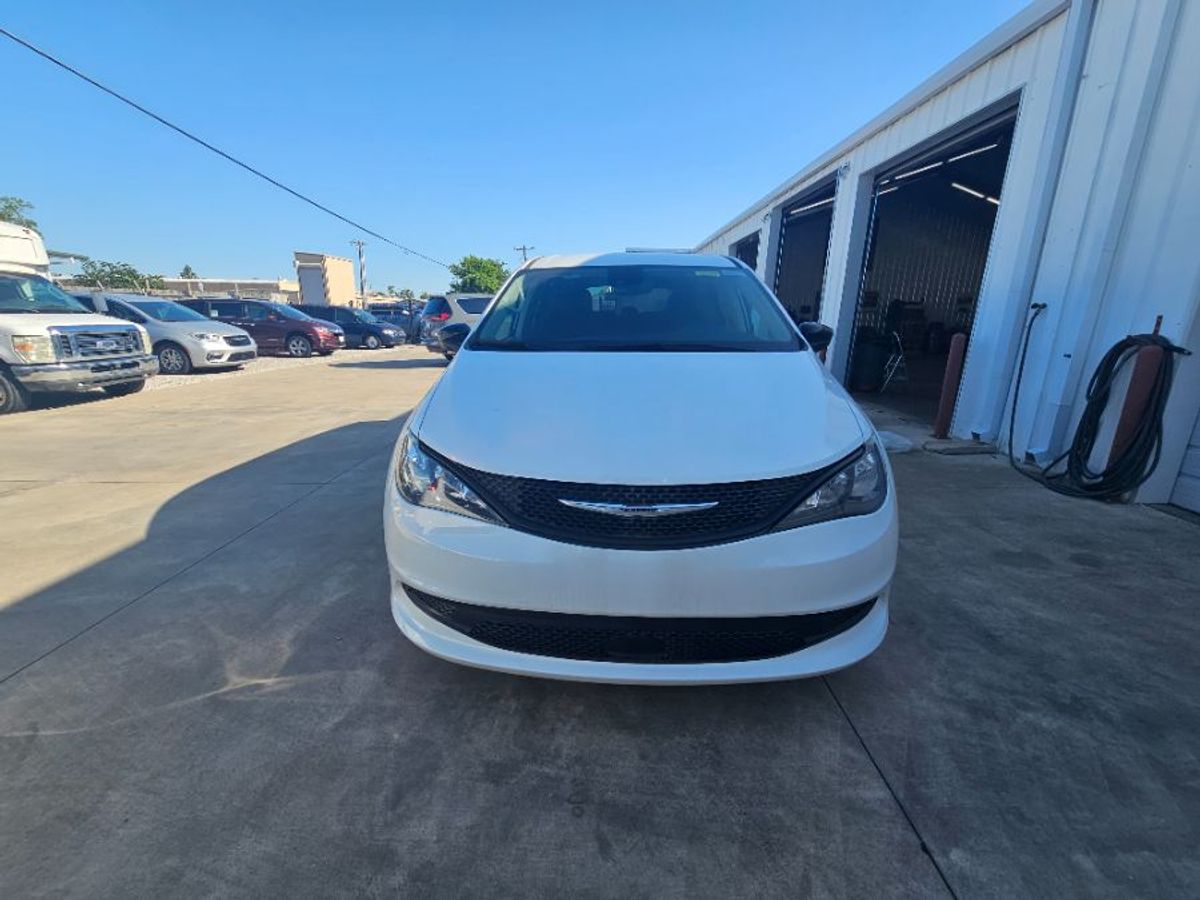 White Chrysler Voyager with Side Entry Automatic Fold Out ramp