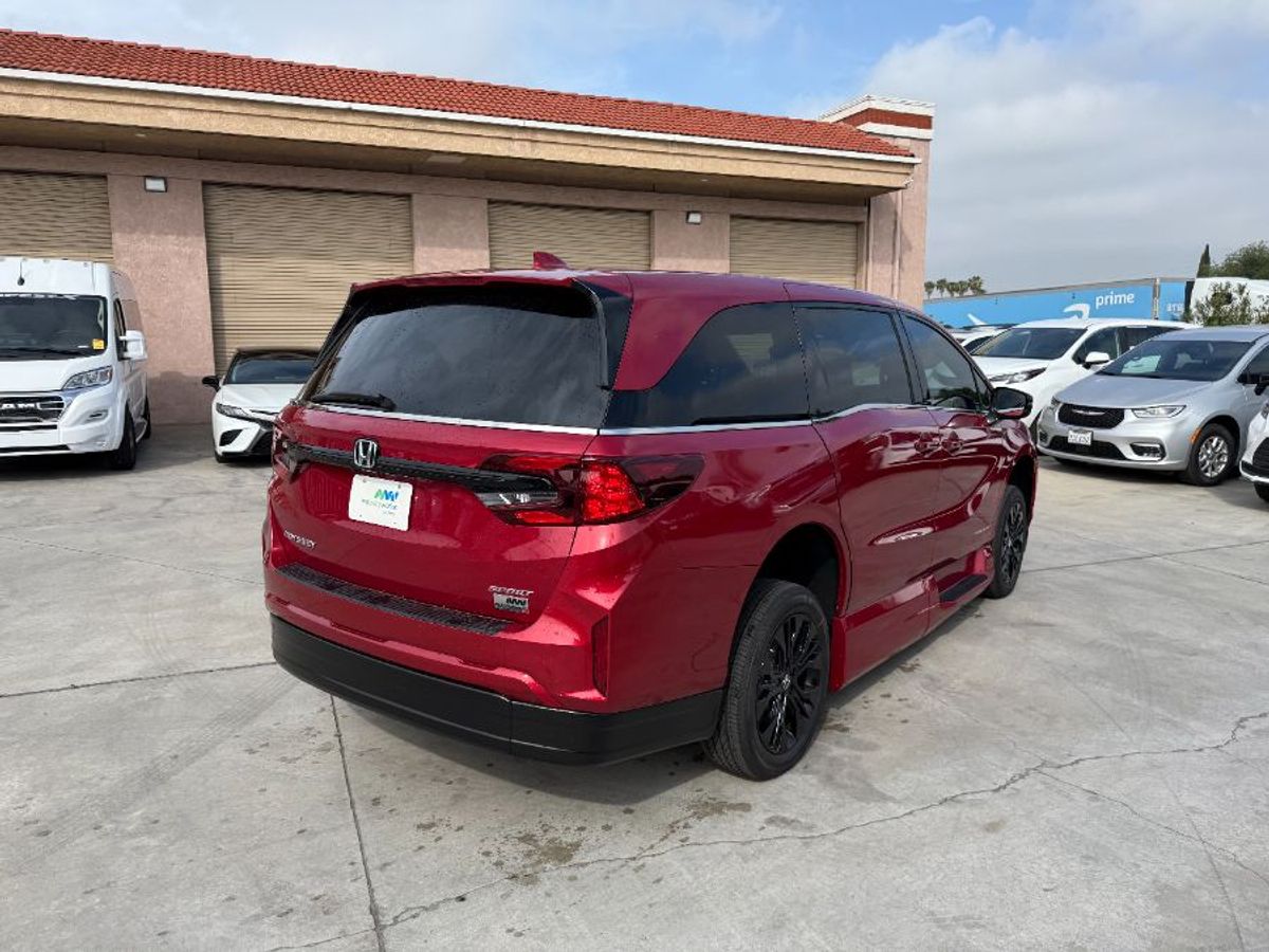 Red Honda Odyssey with Side Entry Automatic In Floor ramp