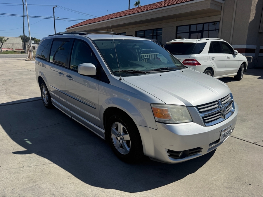 Silver Dodge Grand Caravan with Side Entry Manual Fold Out ramp